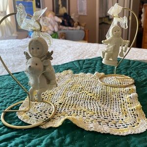 Two Snowbabies ornaments with display stands. $23.00